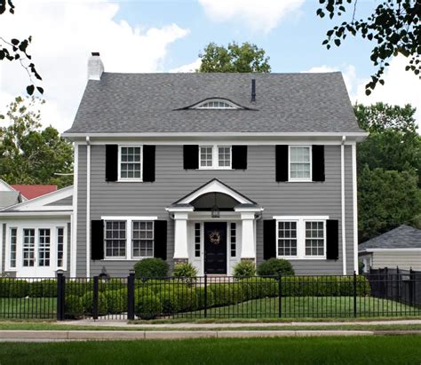 grey metal roof houses|grey houses with black shutters.